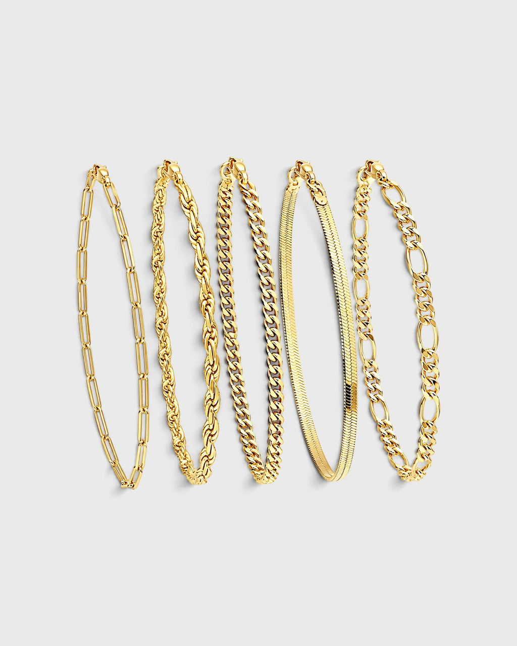 Set di cinque bracciali a catena dorati