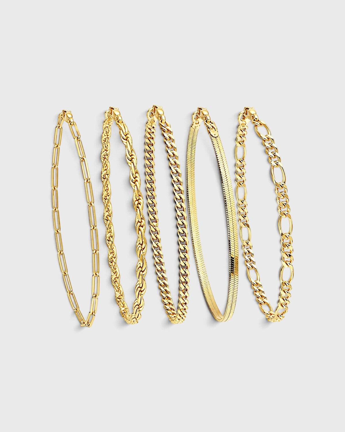 Set di cinque bracciali a catena dorati