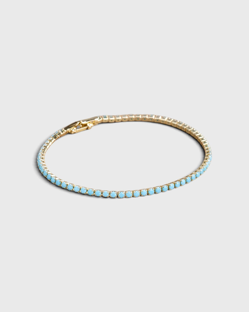 Bracciale tennis dorato con pietre turchesi