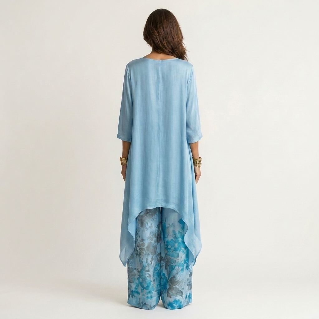 Carola, coordinato con tunica asimmetrica e pantaloni stampati, azzurro chiaro